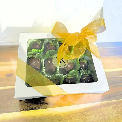 A box of Chocolate Covered Strawberries – Gift Wrapped with a gold ribbon, featuring hand-dipped gourmet strawberries in a sleek presentation box.