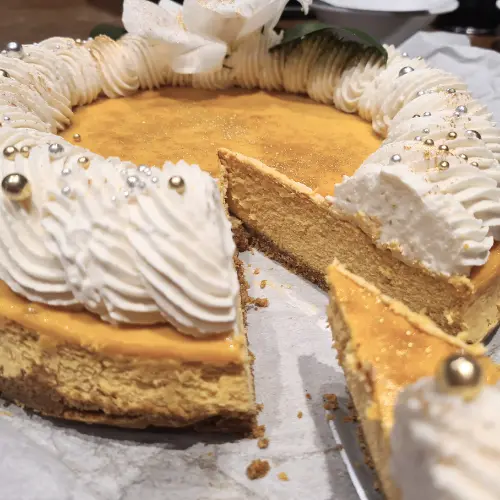 Pumpkin Spice Cheesecake with a slice removed from Calgary's Kakes & Kanvas