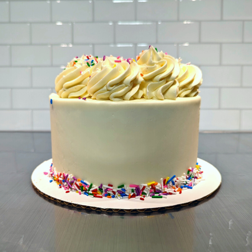Classic birthday cake clean cover with rossettes and rainbow sprinkles