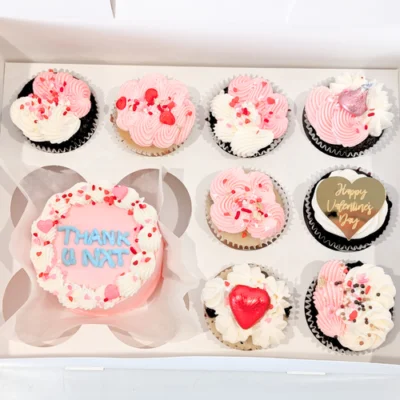 A box of Valentine’s Naughty Bento Cake Combo, featuring 8 gourmet cupcakes and a playful chocolate bento cake with a cheeky message, perfect for a fun celebration.